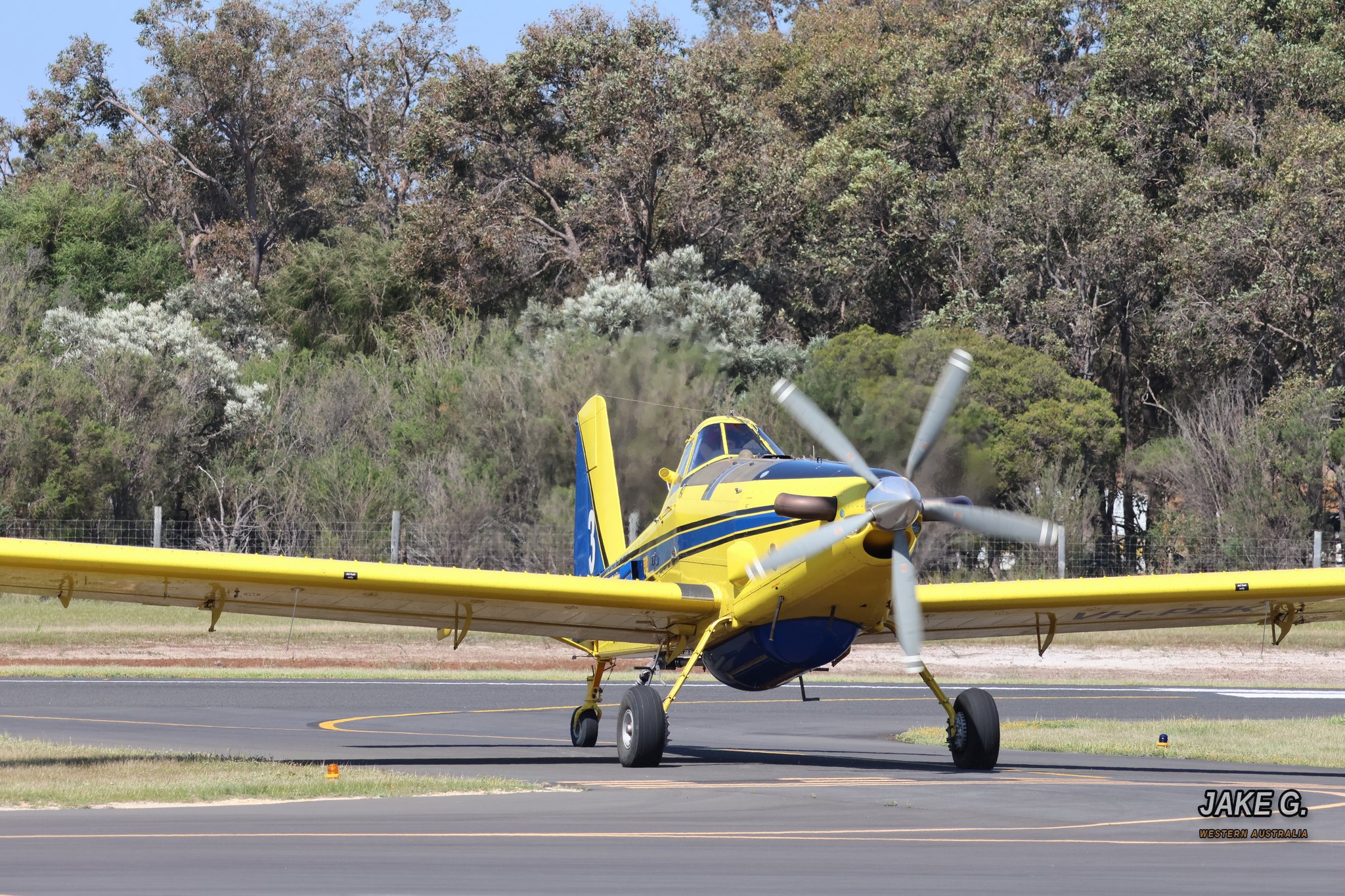 Yellow Air Tractor in Action